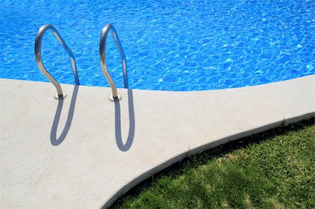 blue tiles swimming pool with green grass garden around Stock Photo - Budget Royalty-Free & Subscription, Code: 400-04371009