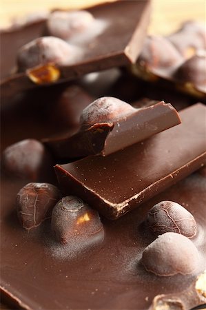 close up of chocolate with hazelnuts, shallow dof Foto de stock - Super Valor sin royalties y Suscripción, Código: 400-04371158