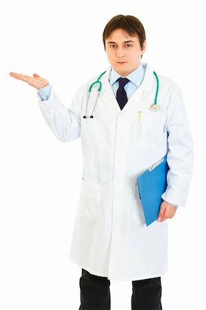 simsearch:400-08339142,k - Authoritative doctor holding medical chart and presenting something on hand isolated on white Photographie de stock - Aubaine LD & Abonnement, Code: 400-04371556