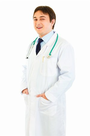 simsearch:400-04351236,k - Smiling medical doctor with hands in pockets isolated on white Stock Photo - Budget Royalty-Free & Subscription, Code: 400-04371551