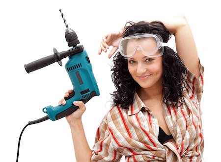 A young smiling female worker with a drilling machine in her hand Stock Photo - Budget Royalty-Free & Subscription, Code: 400-04371988