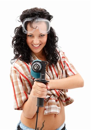 A young smiling female worker with a drilling machine in her hand Stock Photo - Budget Royalty-Free & Subscription, Code: 400-04371991