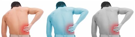 simsearch:400-06476910,k - Young man having pain in his back Stock Photo - Budget Royalty-Free & Subscription, Code: 400-04372048