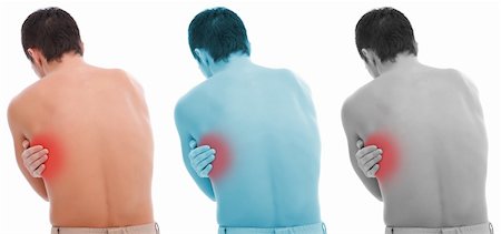 simsearch:400-06476910,k - Young man holding his back, having pain Stock Photo - Budget Royalty-Free & Subscription, Code: 400-04372051