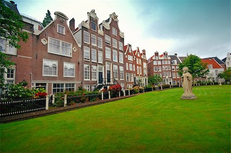 dutch church canal - Photo of old houses and sculpture on the lawn, Amsterdam Stock Photo - Budget Royalty-Free & Subscription, Code: 400-04384444