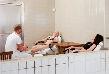 simsearch:400-07323800,k - A woman receiving a foot massage with a friend in a spa Foto de stock - Royalty-Free Super Valor e Assinatura, Número: 400-04384632