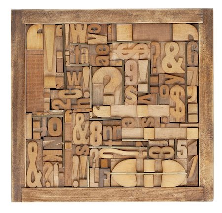 puntuación - box of vintage wood printing blocks - letters, numbers, symbols, punctuation marks, brass inserts Foto de stock - Super Valor sin royalties y Suscripción, Código: 400-04384723