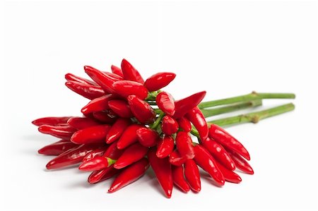 simsearch:400-05732421,k - Red hot chilly peppers on white background Photographie de stock - Aubaine LD & Abonnement, Code: 400-04384737