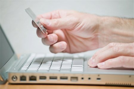 Man using credit card online, concept photography Stock Photo - Budget Royalty-Free & Subscription, Code: 400-04385001