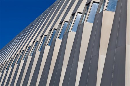 Fragment of modern building on blue sky background Stock Photo - Budget Royalty-Free & Subscription, Code: 400-04385253