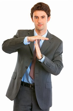simsearch:400-05285550,k - Confident young businessman time out crossed arms isolated on white Stockbilder - Microstock & Abonnement, Bildnummer: 400-04386155