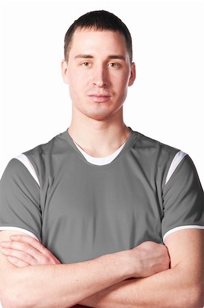 serious face sport - soccer player with folded hands, cut out from white Stock Photo - Budget Royalty-Free & Subscription, Code: 400-04386378