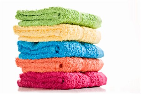 Colorful towels on a white background with space for text Foto de stock - Super Valor sin royalties y Suscripción, Código: 400-04386801