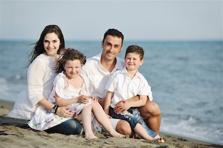 happy young family have fun and live healthy lifestyle on beach Stock Photo - Budget Royalty-Free & Subscription, Code: 400-04387430