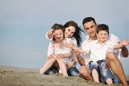 happy young family have fun and live healthy lifestyle on beach Stock Photo - Budget Royalty-Free & Subscription, Code: 400-04387431