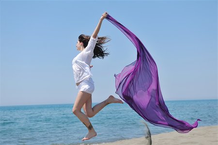 beautiful young woman on beach with scarf Stock Photo - Budget Royalty-Free & Subscription, Code: 400-04389779