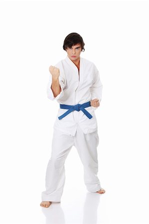 simsearch:640-02952080,k - Karate. Man in a kimono , isolated on the white background Photographie de stock - Aubaine LD & Abonnement, Code: 400-04389836