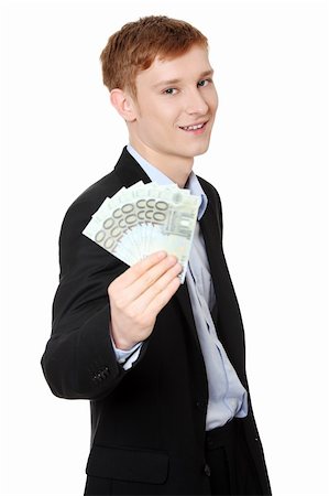 simsearch:400-06102745,k - Young handsome businessman holding euros money. Isolated on white background. Photographie de stock - Aubaine LD & Abonnement, Code: 400-04389893