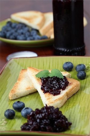 Toasts with blueberry jam and fresh blueberries. Shallow dof Stock Photo - Budget Royalty-Free & Subscription, Code: 400-04380214