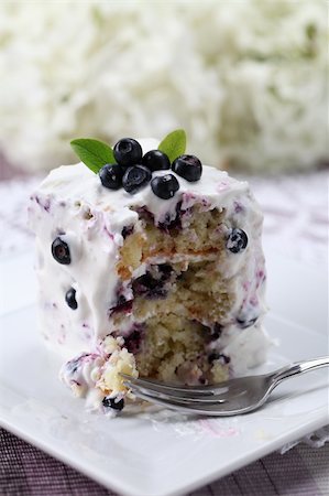 simsearch:400-04380218,k - Delicious homemade blueberry cake with sour cream with a bite. Shallow DOF Stock Photo - Budget Royalty-Free & Subscription, Code: 400-04380211