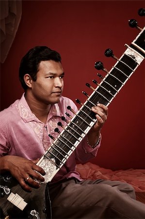 Young Indian man playing Sitar Stock Photo - Budget Royalty-Free & Subscription, Code: 400-04380555