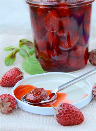 simsearch:400-05345418,k - homemade strawberry jam with whole berries on the table Photographie de stock - Aubaine LD & Abonnement, Code: 400-04381232