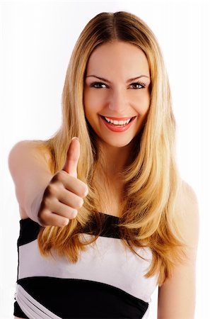 Beautiful woman gesturing thumbs up, isolated Stock Photo - Budget Royalty-Free & Subscription, Code: 400-04381388