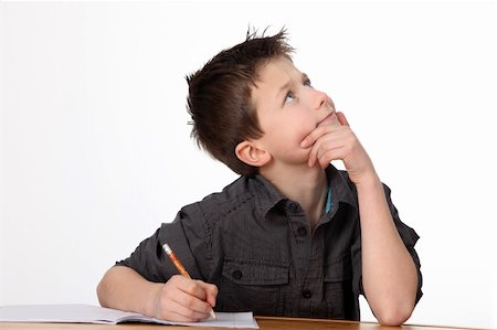 simsearch:400-04123384,k - cute young boy learning with white background Photographie de stock - Aubaine LD & Abonnement, Code: 400-04381418