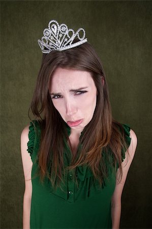 Cute young Caucasian woman with a crown tiara pouts Photographie de stock - Aubaine LD & Abonnement, Code: 400-04381949