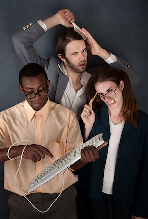 simsearch:400-04382028,k - Man and cross-eyed woman work while handsome man combs his hair Photographie de stock - Aubaine LD & Abonnement, Code: 400-04382020