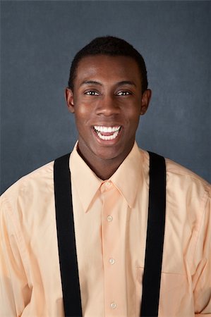 simsearch:400-04382028,k - Handsome African-American male on gray background laughs Photographie de stock - Aubaine LD & Abonnement, Code: 400-04382031