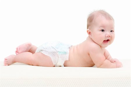 full photo in girls in studio - Five months old baby girl happy crawling on bed Stock Photo - Budget Royalty-Free & Subscription, Code: 400-04382276