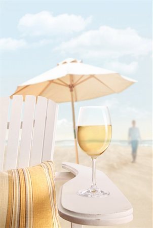 party luxury at the sea - Glass of white wine on adirondack chair at the beach Photographie de stock - Aubaine LD & Abonnement, Code: 400-04382412