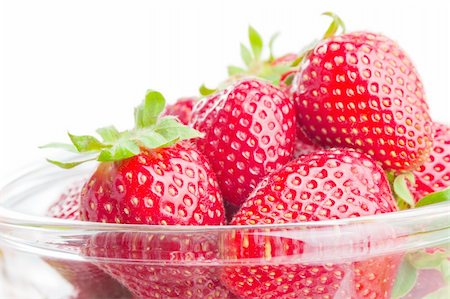 Fresh ripe strawberries  in a glass bowl close-up isolated on white background Stock Photo - Budget Royalty-Free & Subscription, Code: 400-04382460