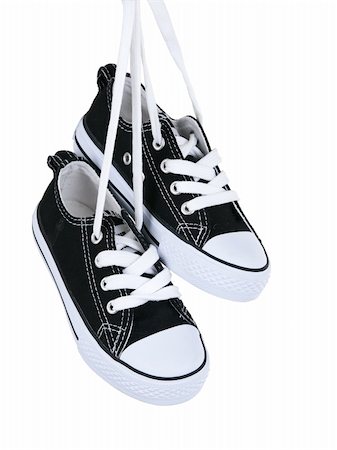 simsearch:400-05294662,k - Vintage hanging black shoes on pure white background Photographie de stock - Aubaine LD & Abonnement, Code: 400-04382603