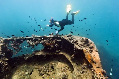 deep sea ship wreck photos - Diver exploring shipwreck underwater. Gunboat at Lusong Island Stock Photo - Budget Royalty-Free & Subscription, Code: 400-04382965