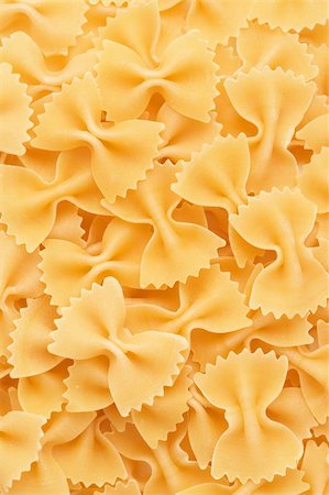 Closeup of Bow tie pasta Farfalloni forming a background Foto de stock - Super Valor sin royalties y Suscripción, Código: 400-04382995