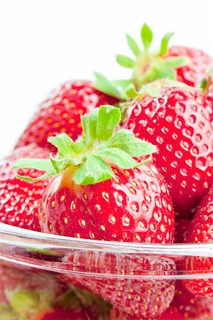 Fresh ripe strawberries  in a glass bowl close-up isolated on white background Stock Photo - Budget Royalty-Free & Subscription, Code: 400-04383247