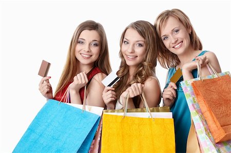 Attractive girls with bags and credit cards on a white background Stock Photo - Budget Royalty-Free & Subscription, Code: 400-04383798