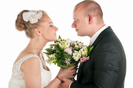 simsearch:400-07332647,k - groom and bride are holding bridal bouquet, cut out from white Stockbilder - Microstock & Abonnement, Bildnummer: 400-04383937