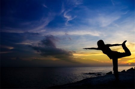 Silhouette of Woman Practicing Yoga Stock Photo - Budget Royalty-Free & Subscription, Code: 400-04394144