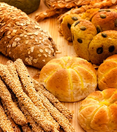 Variety of Organic Breads on plank background Stock Photo - Budget Royalty-Free & Subscription, Code: 400-04394142