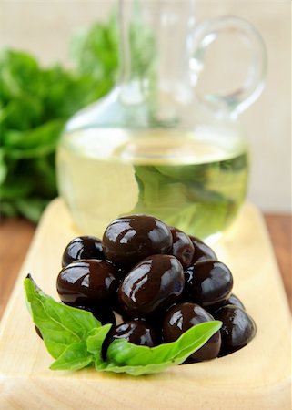 simsearch:400-05666507,k - black olives and a bottle of oil on a wooden stand Stock Photo - Budget Royalty-Free & Subscription, Code: 400-04394170