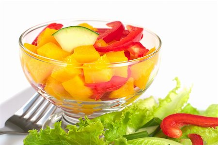 simsearch:400-04854606,k - Fresh salad of mango, red bell pepper, cucumber and lettuce (Selective Focus, Focus one third into the bowl) Foto de stock - Royalty-Free Super Valor e Assinatura, Número: 400-04394329