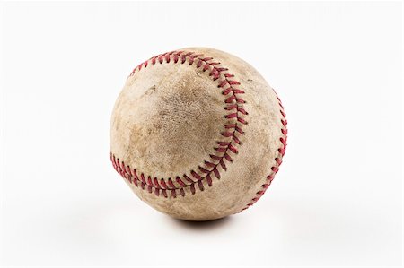 simsearch:400-05089629,k - An old worn baseball against a white background Photographie de stock - Aubaine LD & Abonnement, Code: 400-04394464