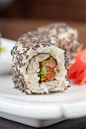 simsearch:689-03123940,k - Closeup of Sushi rolls at plate with sesame Photographie de stock - Aubaine LD & Abonnement, Code: 400-04394565