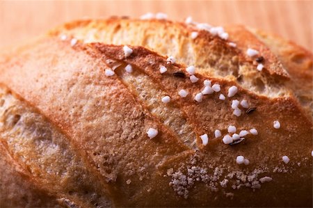 salted bun on an oak table Stock Photo - Budget Royalty-Free & Subscription, Code: 400-04395011