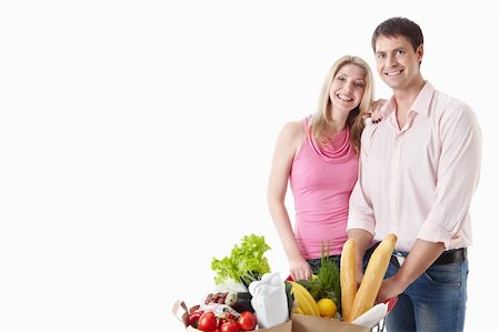 The happy couple with food on a white background Stock Photo - Budget Royalty-Free & Subscription, Code: 400-04395979