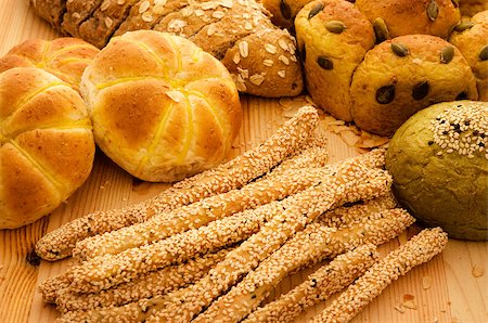 Variety of Organic Breads on plank background Stock Photo - Budget Royalty-Free & Subscription, Code: 400-04397096