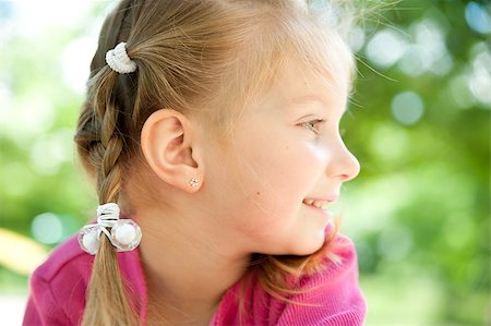 simsearch:400-05342069,k - cute little girl smiling in a park close-up Stock Photo - Budget Royalty-Free & Subscription, Code: 400-04397356